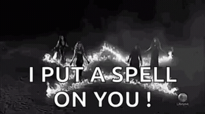 Black And White Photo Of Women Standing In Front Of Fire Spell GIF