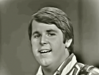 Black And White Photo Of Young Man Smiling GIF