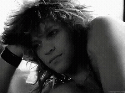 Black and White Photo of Young Man With Curly Hair