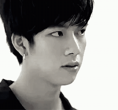 Black And White Photo Of Young Man With Serious Look GIF