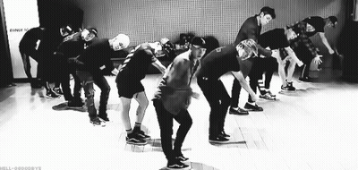 Black And White Photo Of Young Men Dancing On Stage GIF