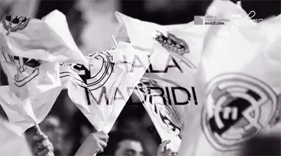 Black And White Photo People Holding Madrid Flags GIF