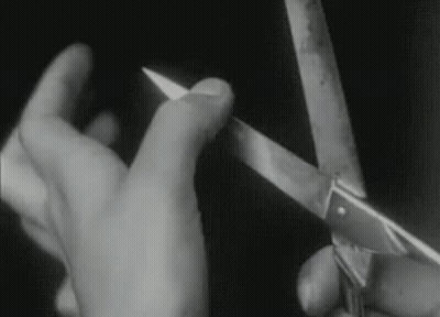 Black And White Photo Person Holding Scissors GIF
