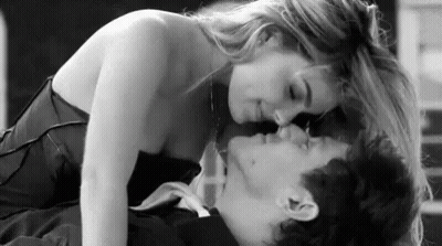 Black And White Photo Woman Kissing Man On Neck GIF