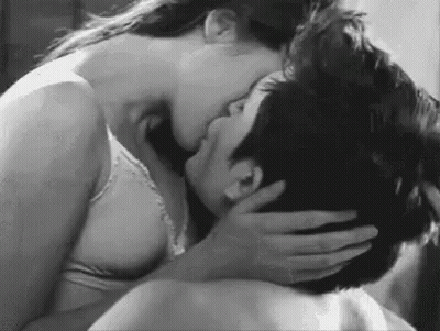 Black And White Photo Woman Kissing Man On Neck GIF