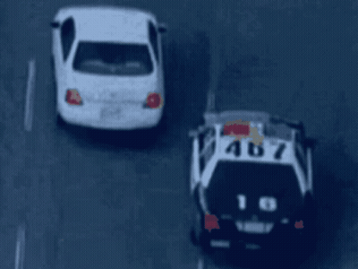 Black And White Police Car Number 18 GIF