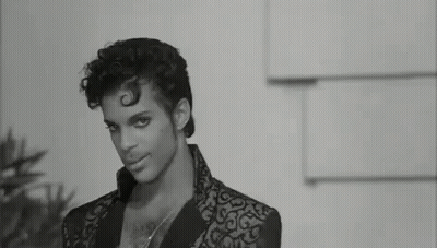 Black And White Prince In Suit And Necklace GIF