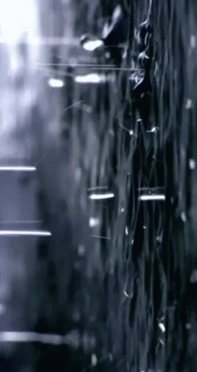 Black And White Rain Drops On Window GIF