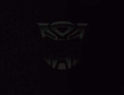 Black And White Robot Holding Yellow Object GIF