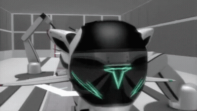 Black And White Robot With Green T On Face GIF