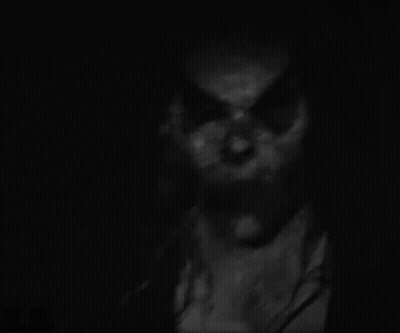 Black And White Scary Face In The Dark GIF