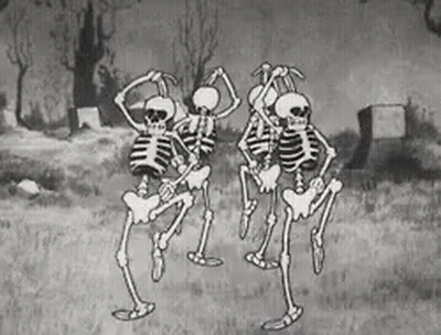 Black And White Skeletons Dancing In Cemetery GIF