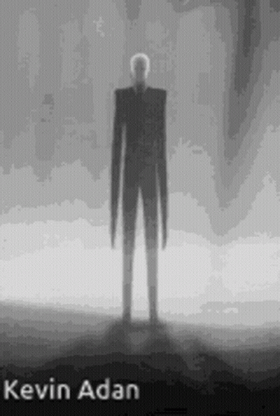 Black And White Slender Man Standing In Dark GIF