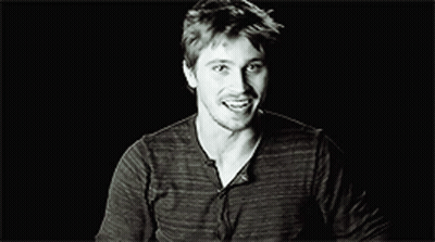 Black And White Smiling Man In Striped Shirt GIF