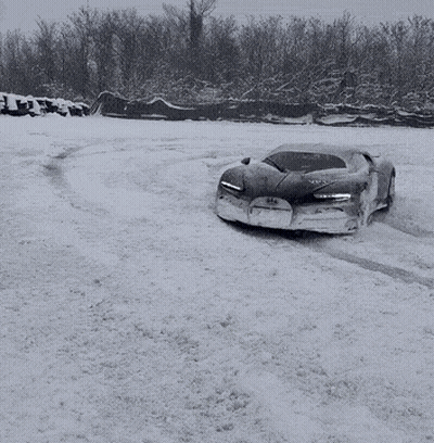 Black And White Snow Photo Of Car With Bugatti On Front GIF
