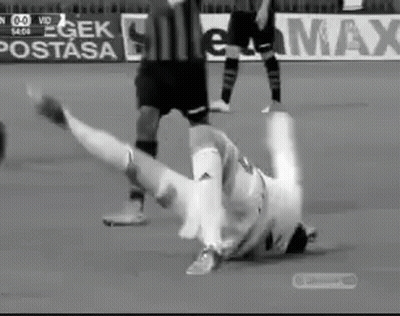 Black And White Soccer Player Falling On Field GIF