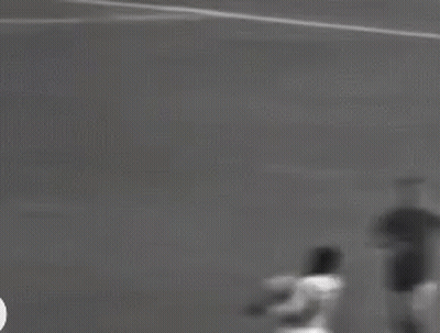 Black And White Soccer Player Kicking Ball GIF