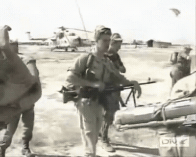 Black And White Soldiers Carrying Helicopter GIF