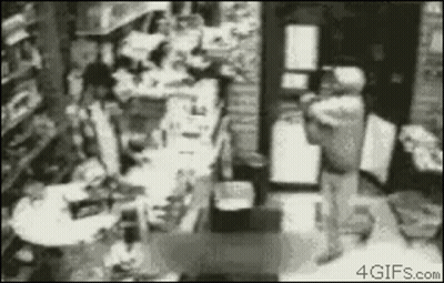 Black And White Store With Person Standing GIF