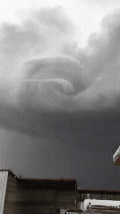 Black And White Stormy Sky With Volvo Sign GIF