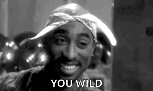 Black And White Tupac Shakur In Bandana And Hat Saying You Wild GIF