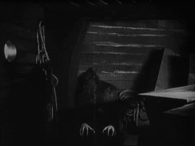 Black And White Vampire With Long Claws GIF