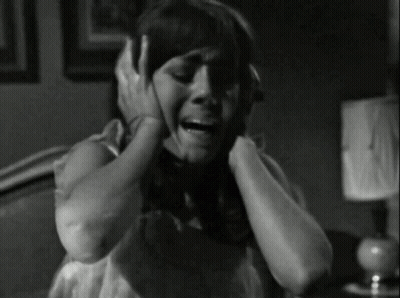 Black And White Woman Covering Ears GIF