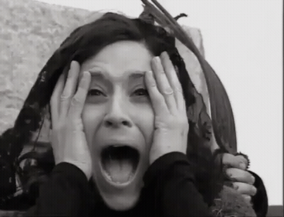 Black And White Woman Covering Face GIF