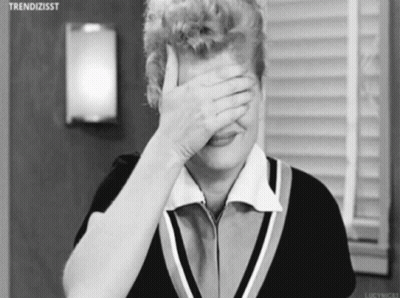 Black And White Woman Covering Face With Hand GIF