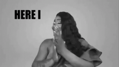 Black And White Woman Covering Mouth Saying Here I GIF