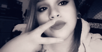 Black And White Woman Covering Mouth With Finger GIF
