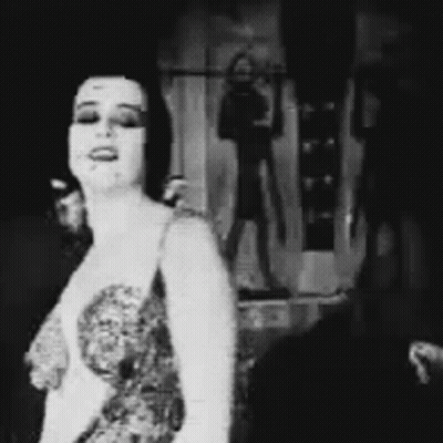 Black And White Woman Dancing In Dress GIF