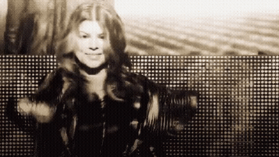 Black And White Woman Dancing In Front Of Lights GIF