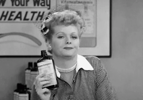 Black And White Woman Holding Bottle GIF