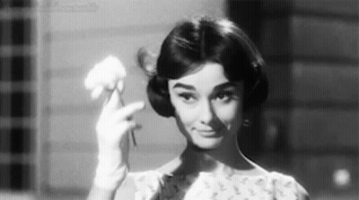 Black And White Woman Holding Flower GIF