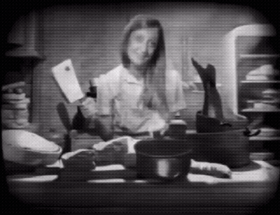Black And White Woman Holding Knife And Bottle GIF