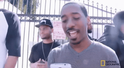 Black And White Woman Holding Man's Head GIF