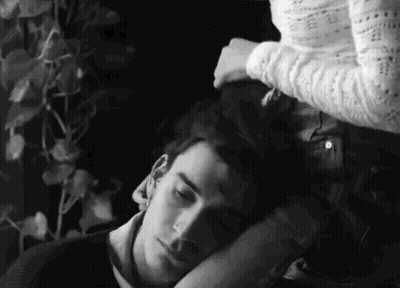 Black And White Woman Holding Man's Head GIF