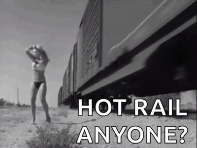 Black and White Woman in Bikini Walking Next to Train