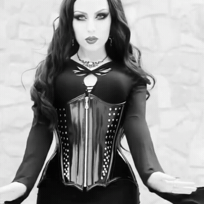 Black And White Woman In Corset Saying Wow GIF