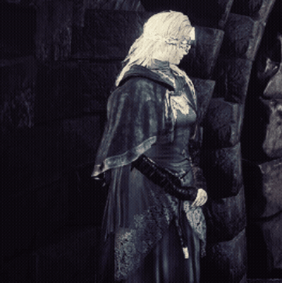 Black And White Woman In Front Of Brick Wall GIF