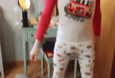 Black And White Woman In Patterned Shirt GIF