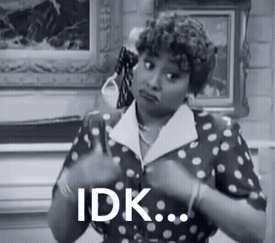 Black And White Woman In Polka Dot Dress Saying Idk GIF