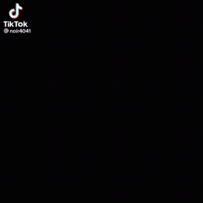 Black And White Woman In Suit On Stairs GIF