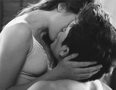 Black And White Woman Kissing Man On Neck GIF