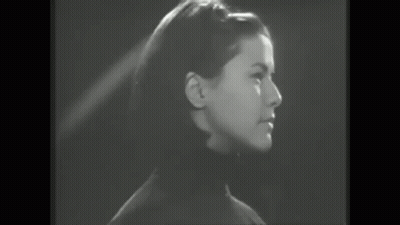 Black And White Woman Laughing In Crowd GIF