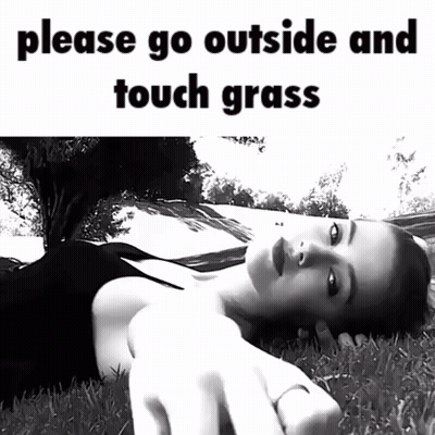 Black And White Woman Laying In Grass Saying Please Go Outside And Touch Grass GIF