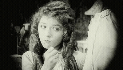 Black And White Woman Looking In Mirror GIF
