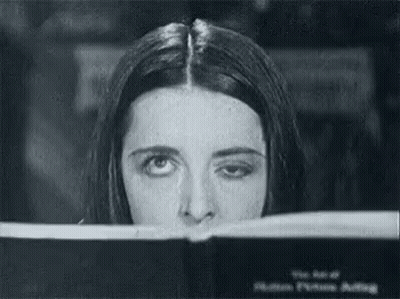 Black And White Woman Looking Through Window GIF