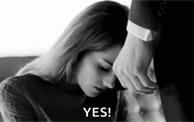 Black And White Woman Lying On Man's Lap Man Holding Head GIF